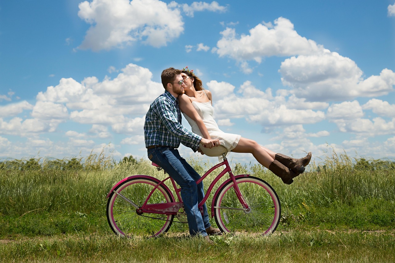 Happy couple cycling outdoors