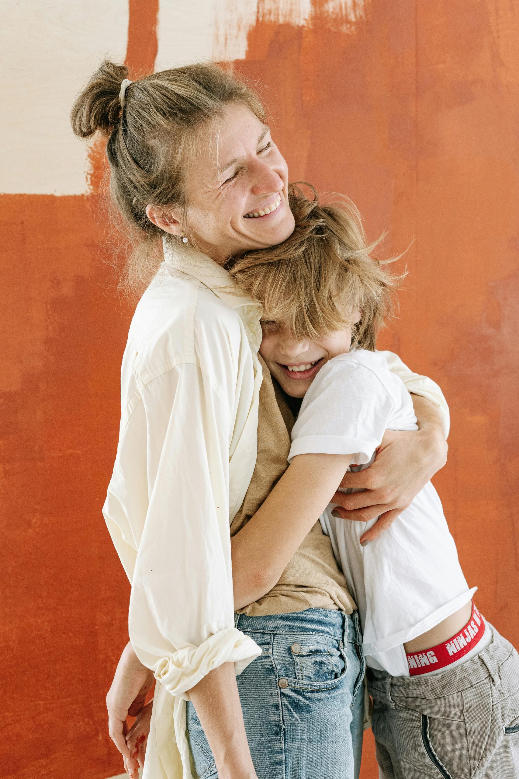 Mother and son hugging